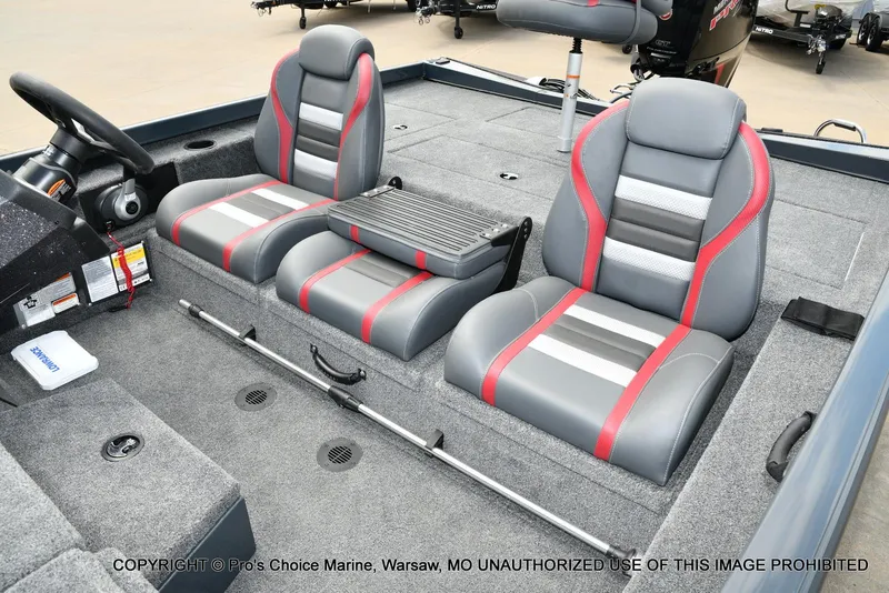 Slide: The Image of 2024 Ranger RT188P boat interior with gray and red seats, steering wheel, and storage compartments. - 13