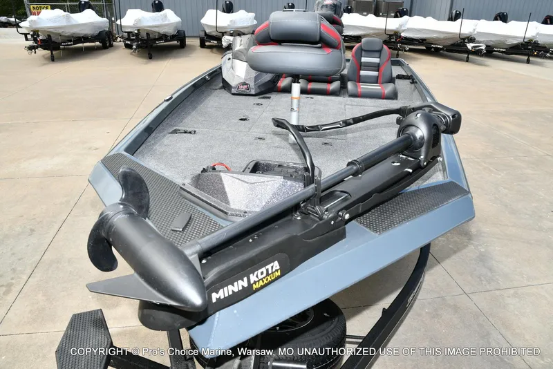 Slide: The Image of 2024 Ranger RT188P boat with Minn Kota trolling motor, parked outdoors. - 26