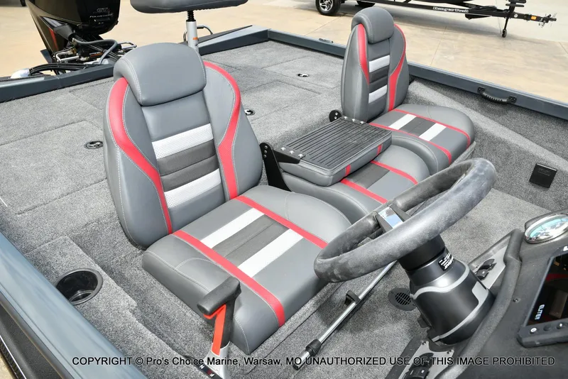 Slide: The Image of 2024 Ranger RT188P boat interior with gray and red seats, steering wheel, and carpeted flooring. - 30