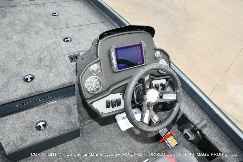 Slide: The Image of 2024 Ranger RT188P boat dashboard with steering wheel and Lowrance display. - 36