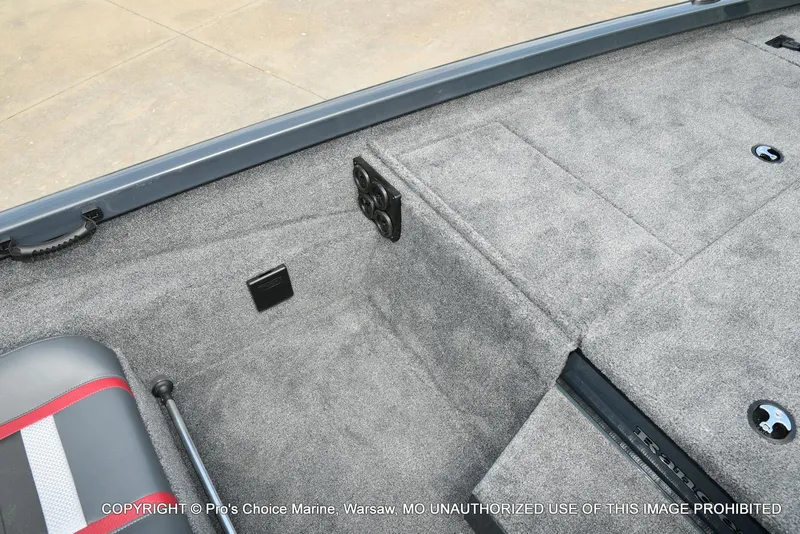 Slide: The Image of 2024 Ranger RT188P boat interior with gray carpet and seating. - 40