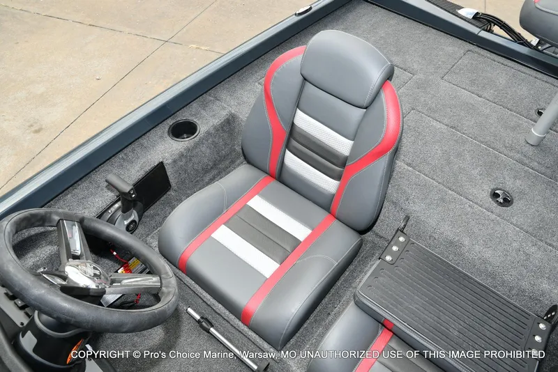 Slide: The Image of 2024 Ranger RT188P boat interior with steering wheel and cushioned seat. - 46