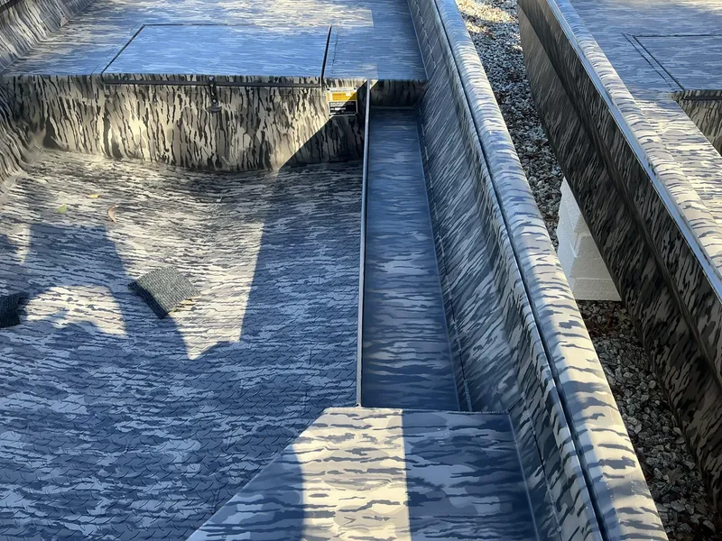 Slide: The Image of 2025 Reaper Boats 656 STEP TRANSOM MID DECK with camouflage pattern, detailed interior view. - 5