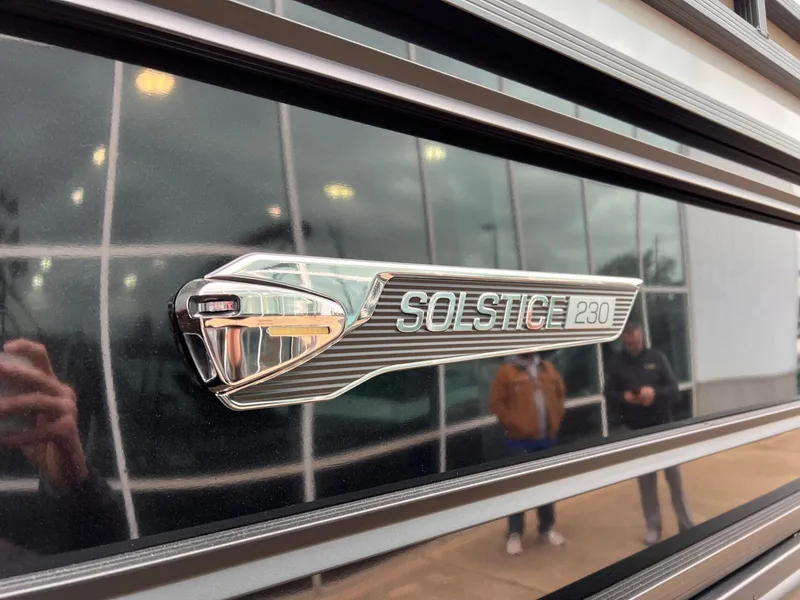 Slide: The Image of 2025 Harris Solstice 230 emblem on reflective surface, showcasing sleek design. - 10