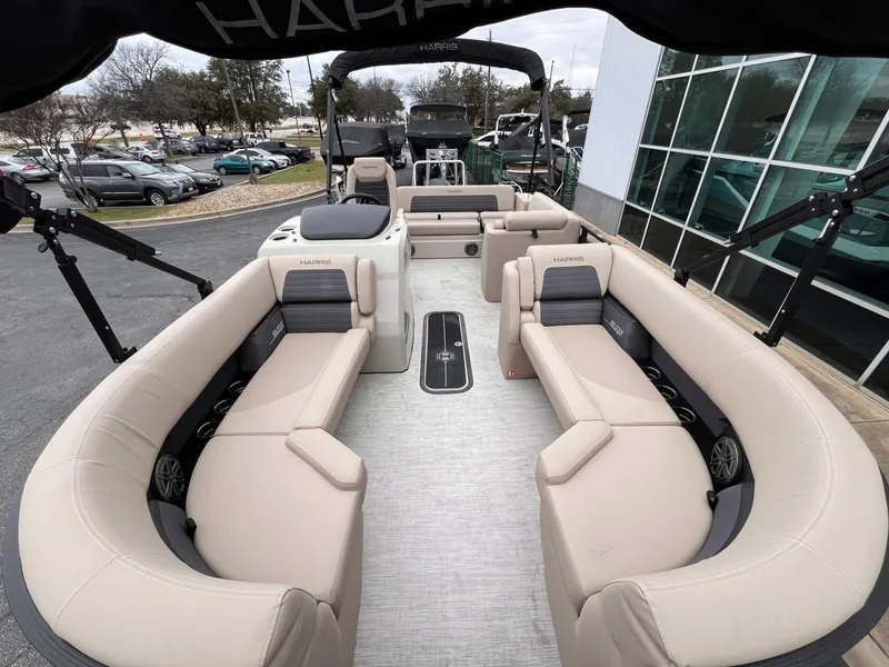 Slide: The Image of 2025 Harris Solstice 230 pontoon boat with spacious seating and modern design. - 12