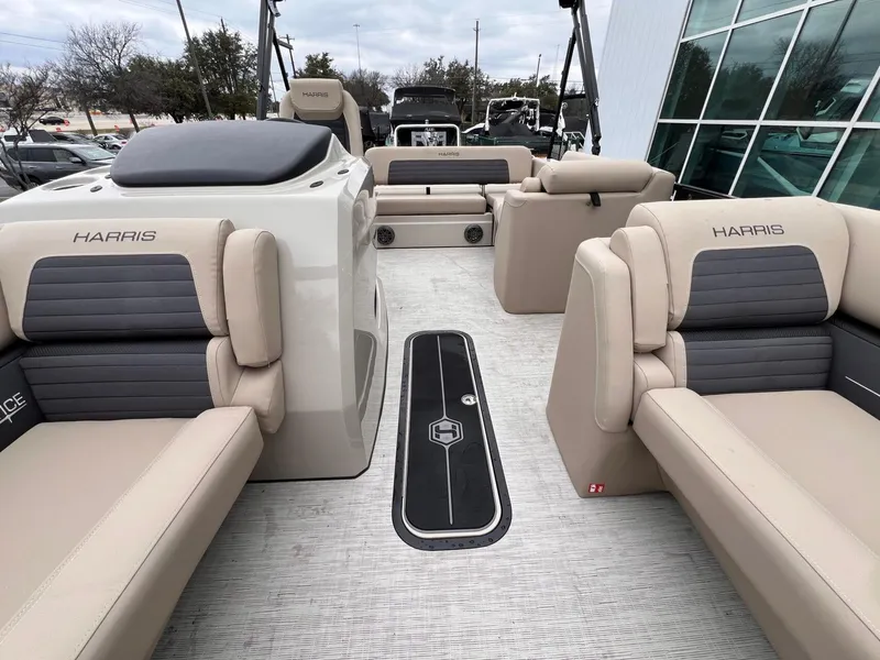 Slide: The Image of 2025 Harris Solstice 230 boat interior with beige seating and modern design. - 15