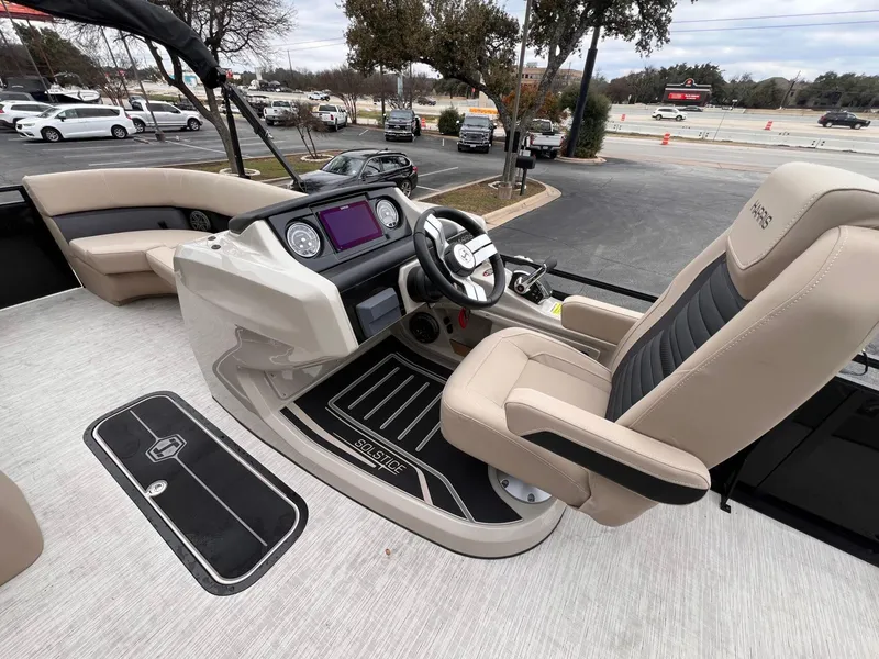 Slide: The Image of 2025 Harris Solstice 230 boat interior with modern helm and seating. - 18
