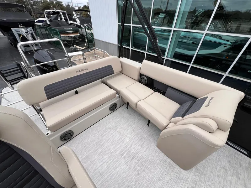 Slide: The Image of 2025 Harris Solstice 230 boat interior with beige seating and modern design. - 25