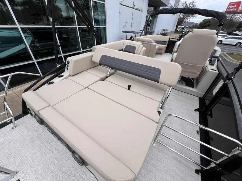 Slide: The Image of 2025 Harris Solstice 230 boat with beige seating and modern design. - 30