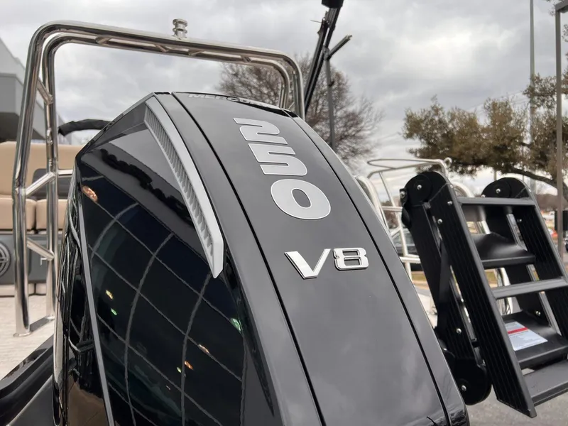 Slide: The Image of 2025 Harris Solstice 230 boat with 250 V8 engine, showcasing sleek design and power. - 5