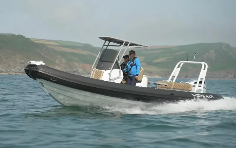 Slide: The Image of 2025 Highfield Sport 760 boat cruising on open water. - 5