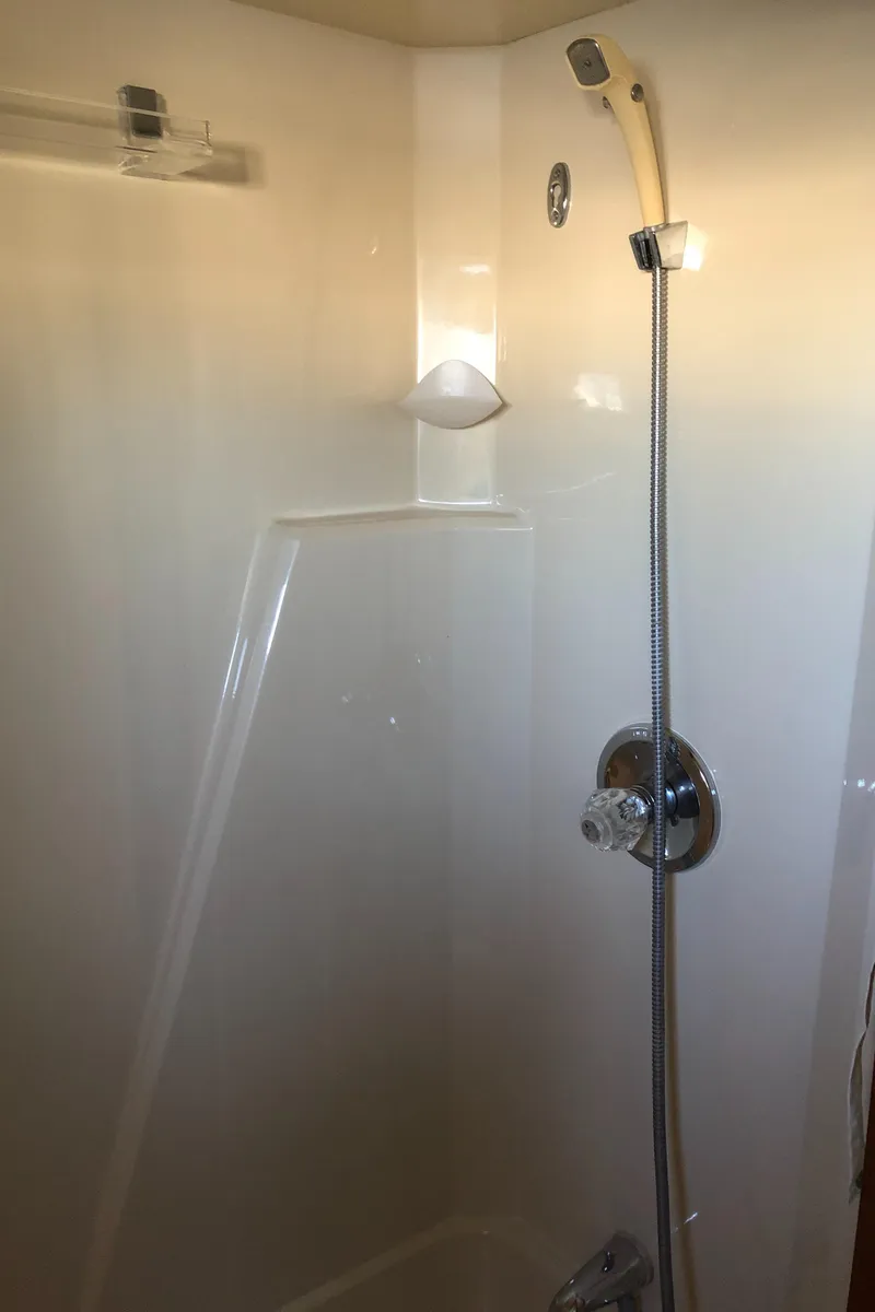 Slide: The Image of Shower area in 1987 Chris-Craft 426 Catalina yacht, featuring modern fixtures. - 21