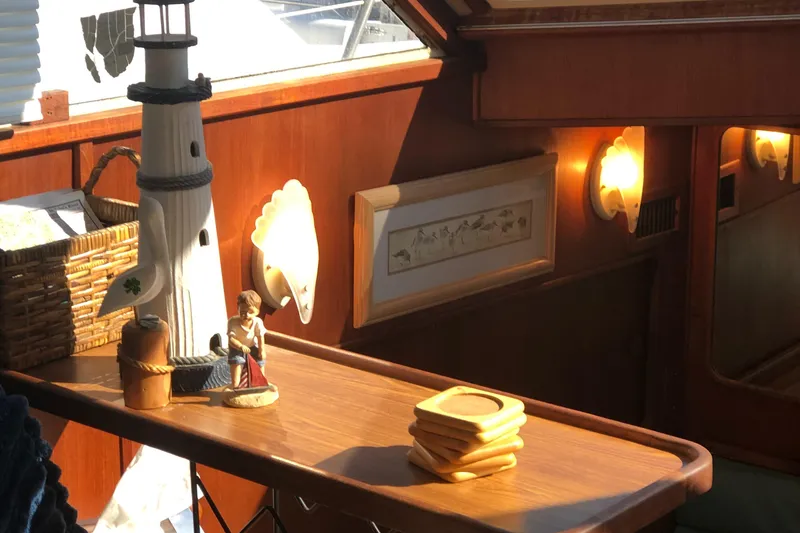 Slide: The Image of Interior of 1987 Chris-Craft 426 Catalina with nautical decor and warm lighting. - 22