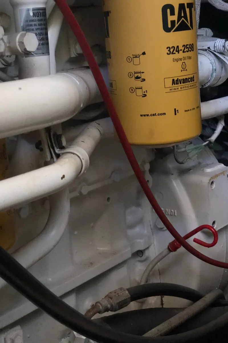 Slide: The Image of Engine compartment of 1987 Chris-Craft 426 Catalina with CAT filter and pipes. - 23