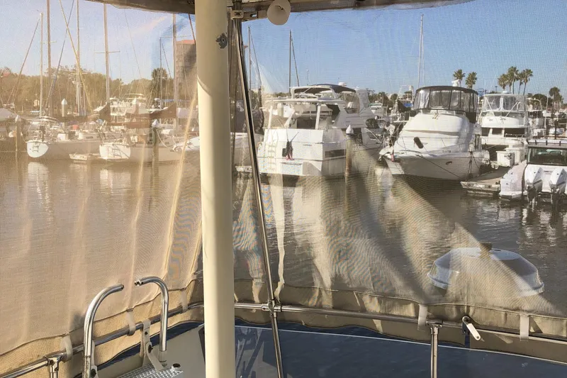 Slide: The Image of View from 1987 Chris-Craft 426 Catalina, overlooking marina with multiple docked boats. - 26
