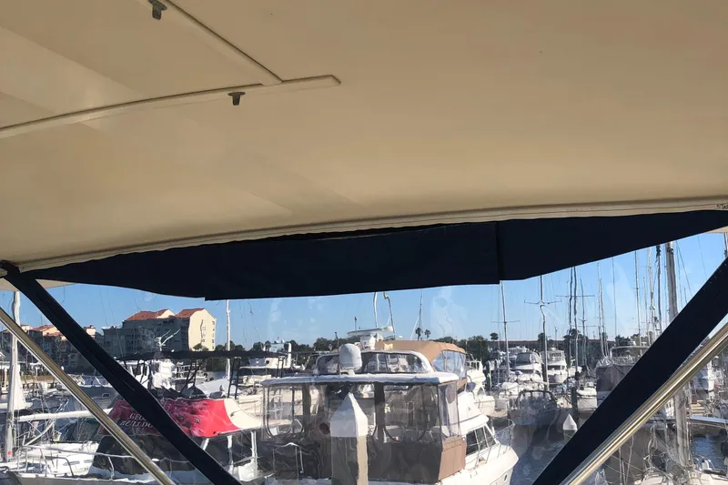 Slide: The Image of View from 1987 Chris-Craft 426 Catalina, overlooking a marina with multiple boats. - 29