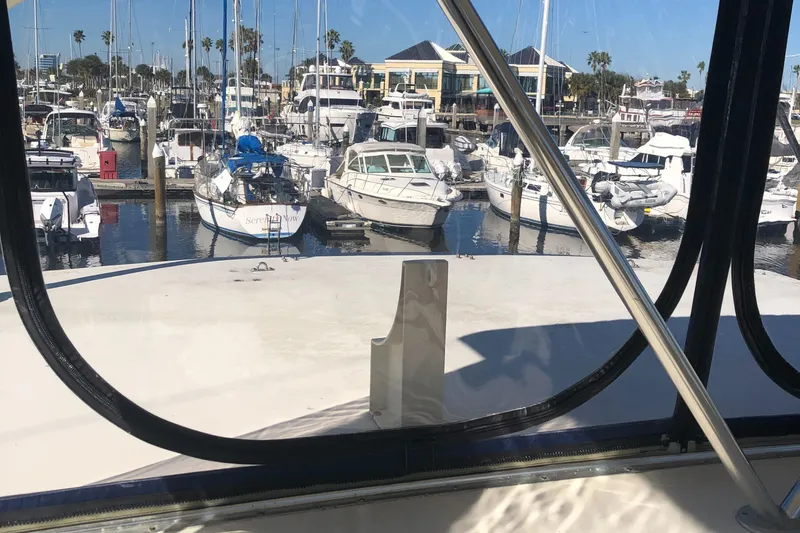 Slide: The Image of View from 1987 Chris-Craft 426 Catalina overlooking marina with boats and clear sky. - 31