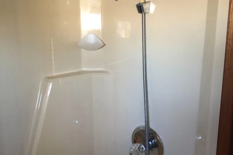 Slide: The Image of Shower area inside 1987 Chris-Craft 426 Catalina boat, featuring a sleek design. - 45