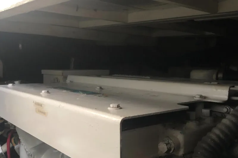 Slide: The Image of Engine compartment of 1987 Chris-Craft 426 Catalina boat, showcasing mechanical components. - 48