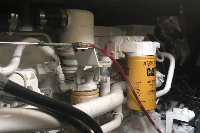 Slide: The Image of Engine compartment of a 1987 Chris-Craft 426 Catalina with visible CAT filter. - 49