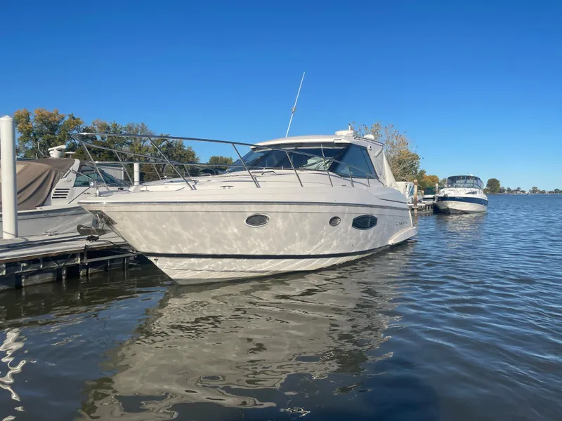 Slide: The Image of 2015 Regal 42 Sport Coupe yacht docked on a sunny day. - 1