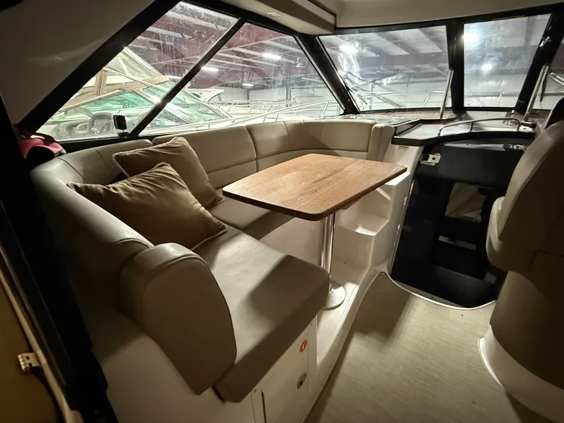 Slide: The Image of Interior of 2015 Regal 42 Sport Coupe with seating and table. - 12