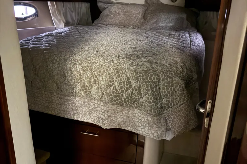 Slide: The Image of Cozy bedroom interior of 2015 Regal 42 Sport Coupe yacht with elegant bedding. - 19