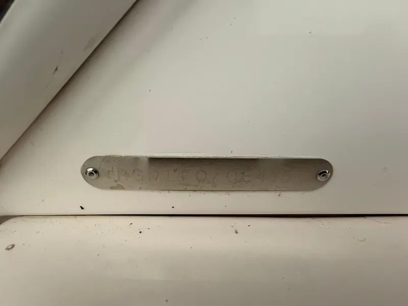 Slide: The Image of Metal identification plate on a 2015 Regal 42 Sport Coupe boat. - 21