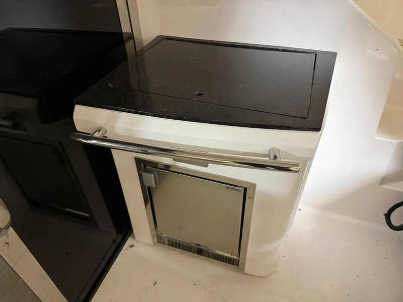 Slide: The Image of Built-in refrigerator on 2015 Regal 42 Sport Coupe yacht. - 22