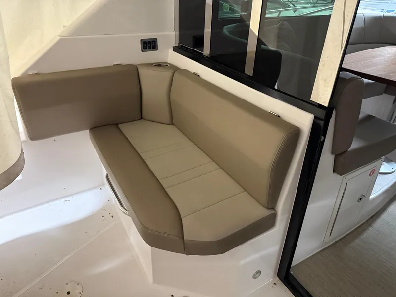 Slide: The Image of 2015 Regal 42 Sport Coupe interior with beige seating and modern design. - 29