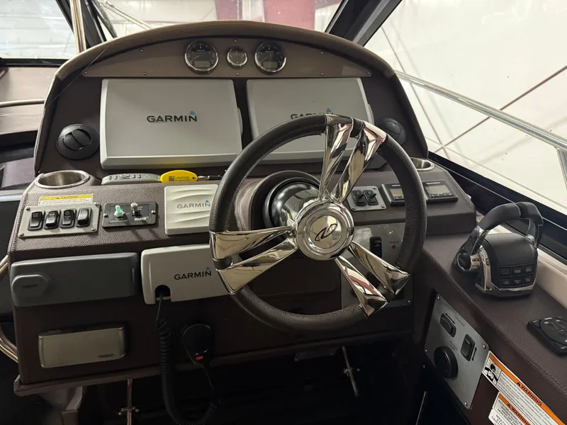 Slide: The Image of Dashboard of a 2015 Regal 42 Sport Coupe with Garmin navigation systems. - 4