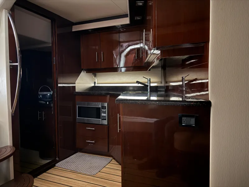 Slide: The Image of Luxurious kitchen interior of 2015 Regal 42 Sport Coupe yacht with modern amenities. - 6