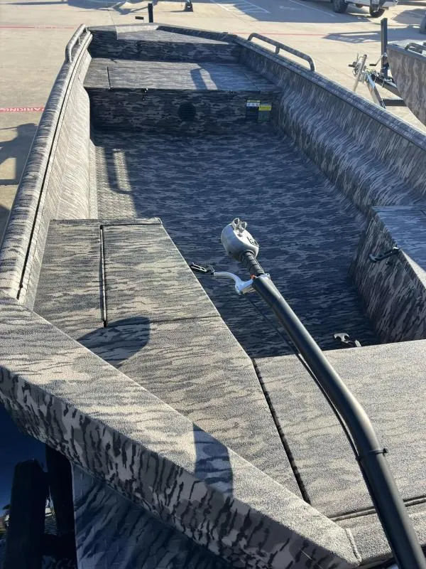 Slide: The Image of 2024 Havoc Boats 1756MSTC interior with camouflage design and steering mechanism. - 10