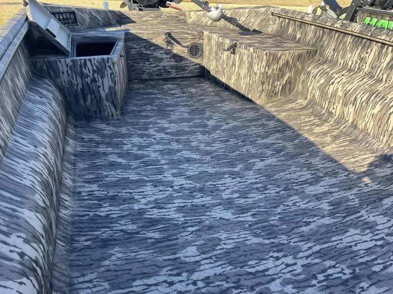 Slide: The Image of 2024 Havoc Boats 1756MSTC interior with camouflage pattern and storage compartments. - 5