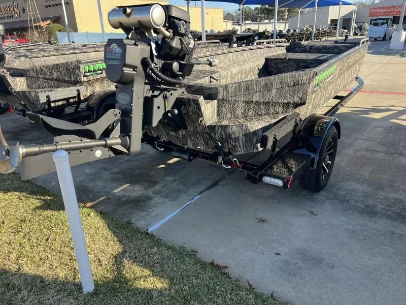 Slide: The Image of 2024 Havoc Boats 1756MSTC on trailer, camo design, outdoor display. - 7