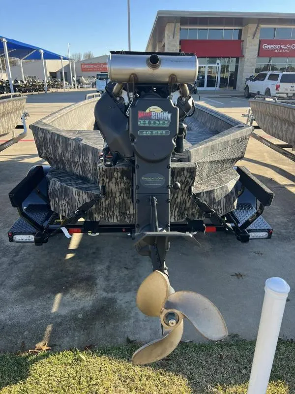 Slide: The Image of 2024 Havoc Boats 1756MSTC with camouflage design and powerful motor, displayed outdoors. - 8