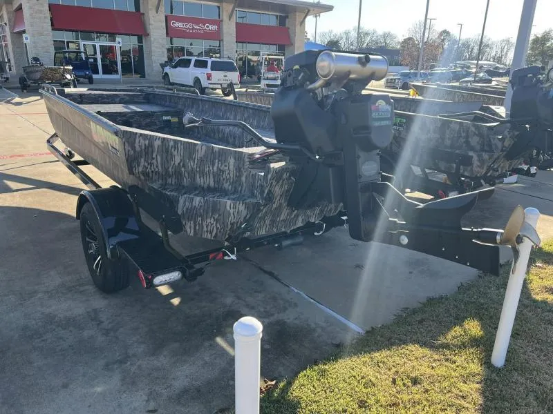 Slide: The Image of 2024 Havoc Boats 1756MSTC camo boat on trailer in dealership lot. - 9