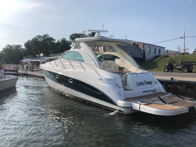 Slide: The Image of 2002 Maxum 4200 SCR yacht docked at marina on a sunny day. - 12