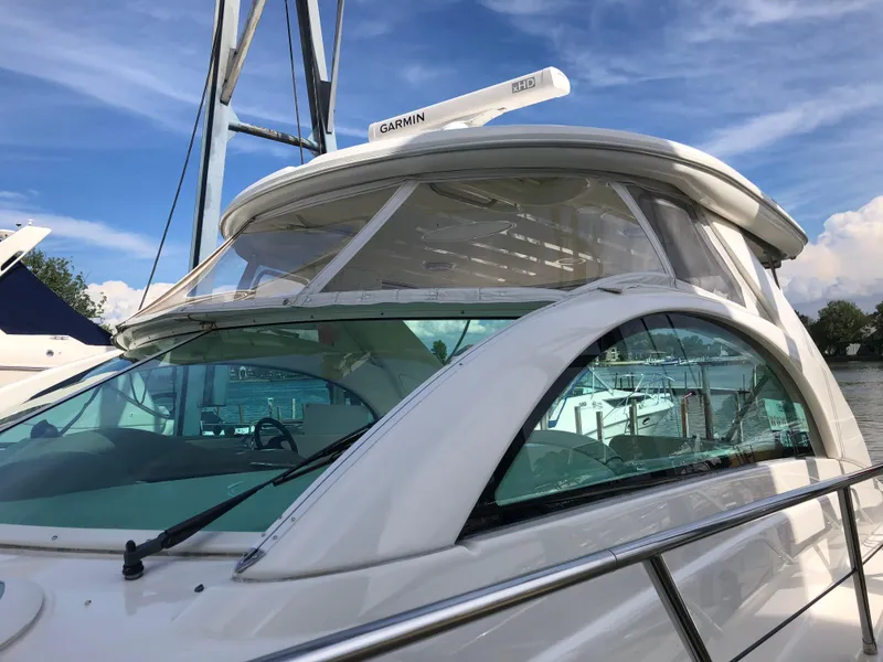 Slide: The Image of 2002 Maxum 4200 SCR yacht with sleek design and Garmin radar. - 13