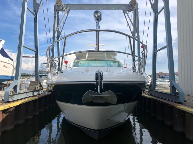 Slide: The Image of 2002 Maxum 4200 SCR yacht docked in marina, front view. - 14