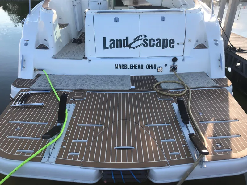 Slide: The Image of Maxum 4200 SCR 2002 boat docked in Marblehead, Ohio, named "Land Escape". - 21