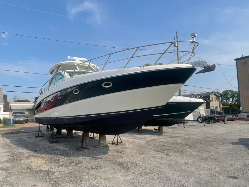 Slide: The Image of 2002 Maxum 4200 SCR yacht on dry dock, side view. - 3