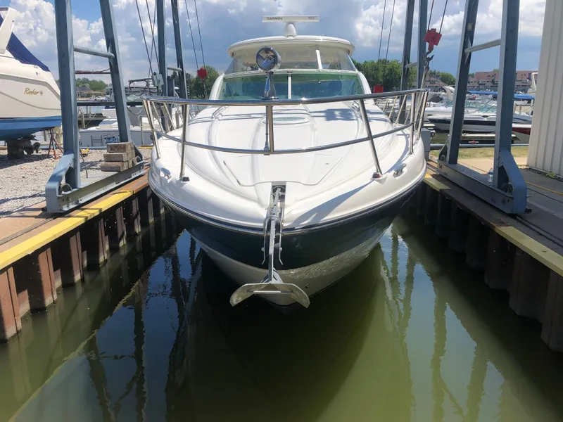 Slide: The Image of 2002 Maxum 4200 SCR yacht docked in marina, front view. - 7