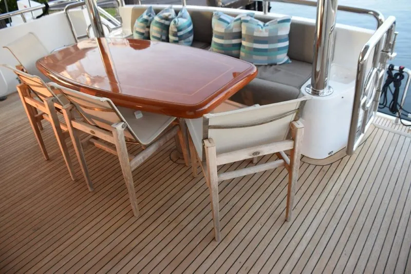 Slide: The Image of Four Teak sling chairs at aft deck table - 66
