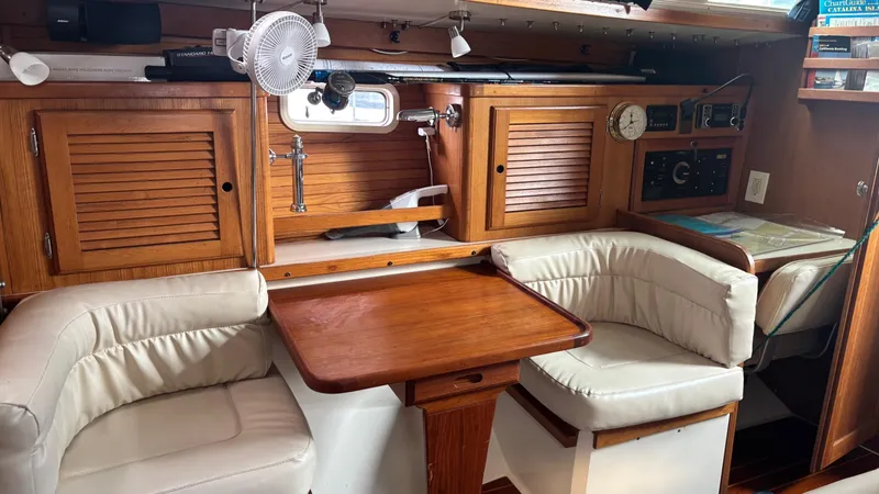 Slide: The Image of Interior of a 1994 Catalina 36 sailboat with wooden cabinetry and cushioned seating. - 22
