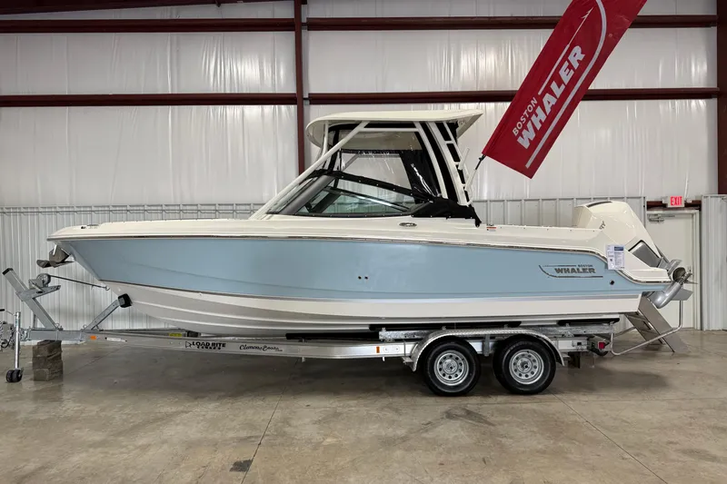 The Image of 2025 Boston Whaler 240 Vantage boat on trailer in indoor storage. - 0