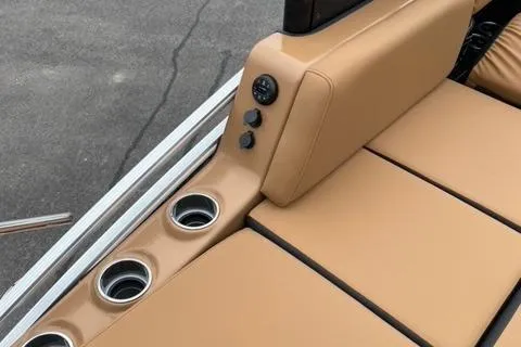Slide: The Image of 2022 Harris Solstice 230 boat interior with tan seating and cup holders. - 13