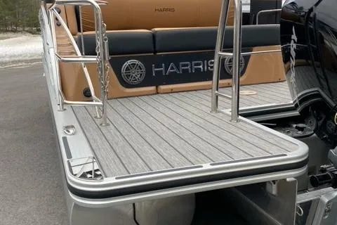 Slide: The Image of 2022 Harris Solstice 230 boat with sleek deck and modern seating. - 17