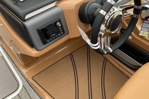 Slide: The Image of 2022 Harris Solstice 230 boat interior with steering wheel and control panel. - 20