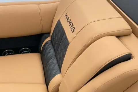 Slide: The Image of Luxury seating in 2022 Harris Solstice 230 boat with tan and black upholstery. - 25